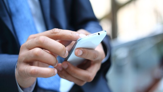 businessman messaging on mobile