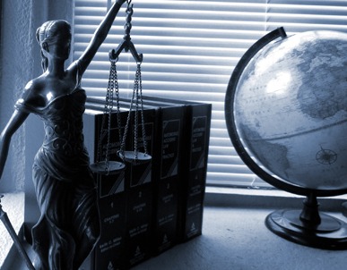 lady justice with law books and globe